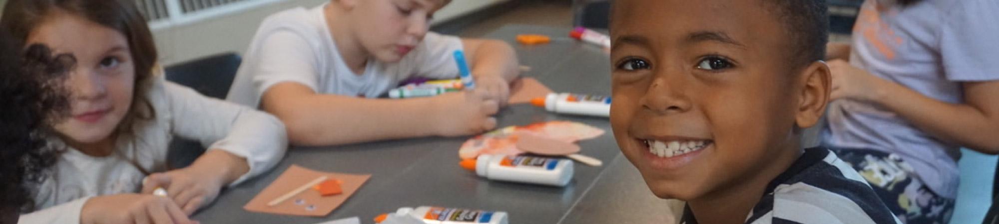 Smiling Boy doing crafts